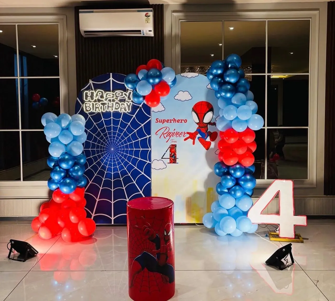 Spider-Man Birthday Decor with balloons, LED age, cake stand and focus light.